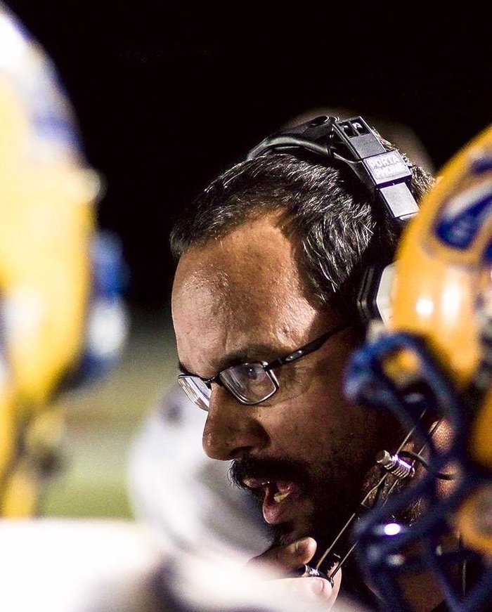 Tom Brittain coaching high-school football on the sideline